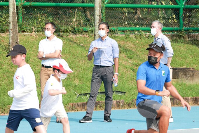 Mr. Kiyotaka ANDO, Chairman of the Advisory Committee of the Charity Fund, Mr. Philip Mok, HKTA President & Mr. Chris Lai, HKTA CEO oversee a training session.